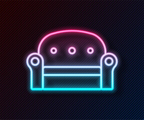 Poster - Glowing neon line Sofa icon isolated on black background. Vector