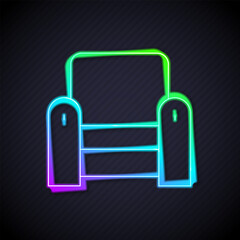 Poster - Glowing neon line Armchair icon isolated on black background. Vector