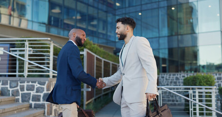 Poster - Businessman, handshake and meeting with colleague in city by steps outside building for greeting or introduction. Business people walking and shaking hands with employee for partnership or welcome