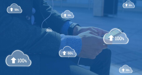 Poster - Image of digital clouds with percent going up over man using smartphone
