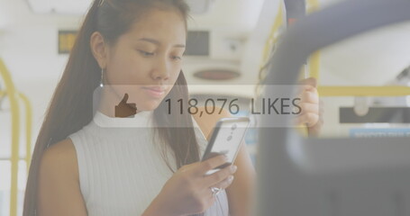 Poster - Image of like icons with increasing numbers against asian woman using smartphone in the bus