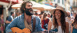 Happy hippie couple playing music and singing with friends in the street, having fun during outdoor party on a sunny day.