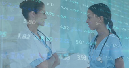 Canvas Print - Image of financial data processing over diverse doctors