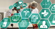 Image of scientific icons in hexagons over diverse female and male lab workers in face masks