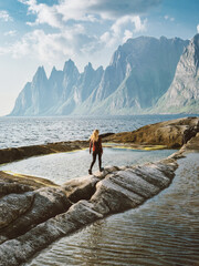 Wall Mural - woman tourist walking in norway travel healthy lifestyle outdoor adventure summer vacations trip exp