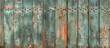 A detailed view of a wooden fence with visible signs of rust and weathering, showcasing the peeling texture and aged appearance.