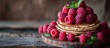 A delicious stack of pancakes with vibrant red raspberries piled on top, ready to be enjoyed.