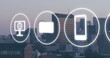 Image of media and business icons over cityscape