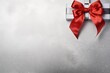 Red ribbon with bow on silver background, Christmas card concept. Space for text. Red and Silver Background 