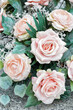 Adorable wedding decoration made of pink artificial roses.
