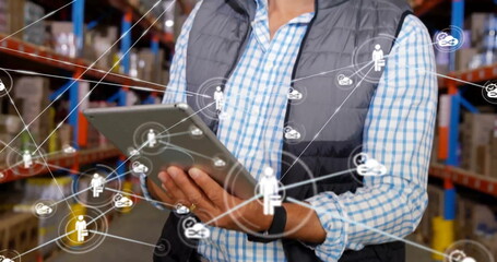 Poster - image of network with icons over caucasian man using tablet in warehouse