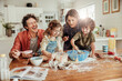 © Marko Geber - Happy family baking together in the kitchen