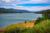 Fototapeta Zwierzęta - Panoramic view of Dexter Reservoir near Eugene, Oregon, with mountain backdrop. Dexter Reservoir, also known as Dexter Lake, is a reservoir in Lane County formed on the Middle Fork Willamette River.