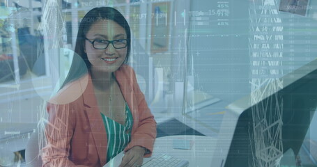 Poster - About a young businesswoman of biracial who is working on a computer and smiling at the camera