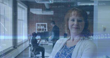 Poster - Image of binary codes, computer language, trading board over caucasian woman standing in office