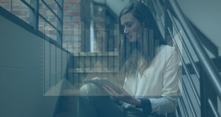 Poster - Image of graphs over thoughtful caucasian woman sitting on staircase using digital tablet