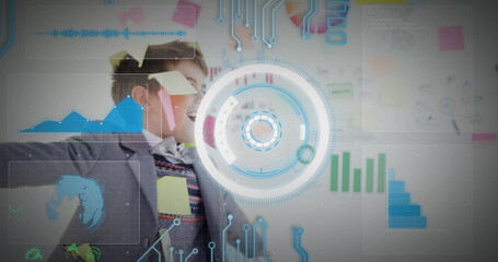 Poster - Image of infographic interface over caucasian boy with sticky notes on face rotating in office