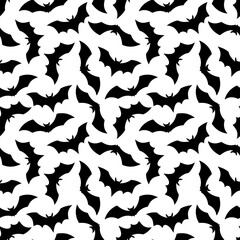 Halloween Bat seamless pattern. Vector Happy Halloween print with flying black bat silhouette on gradient orange background. For wrapping, fabric, holiday decoration, textile, wallpapers.