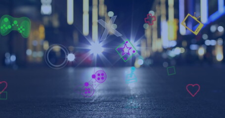Poster - Image of multiple image game icons floating against city traffic at night