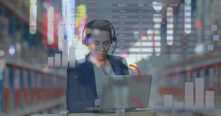 Poster - image of data processing over woman working using laptop in warehouse shipping centre