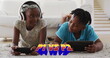 Image of p1 vs p2 text with african american children using tablet and smartphone