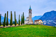 St Abundius (Sant'Abbondio) Church and cypress trees, Collina d'Oro, Ticino, Switzerland