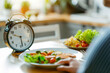 Intermittent fasting concept with salad and clock