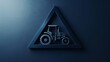 © Prarichart - A blue triangle with a black tractor inside it.