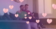 Image of heart icons over happy diverse gay couple embracing