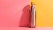   A silver water bottle sits atop a multicolored surface, comprised of pink and yellow hues Nearby stands a wall with pink and yellow sections Another wall shares the same color