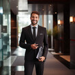 © CreativeCaptures - a scene of a hotel manager warmly welcoming guests into a lavish hotel lobby, with opulent decor, plush furnishings, and impeccable service, conveying a sense of luxury , sophistication in an elegant