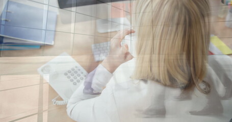 Poster - Image of caucasian businesswoman using computer over people walking