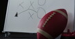 Image of lens flare, abstract pattern over rugby ball, water sipper and game plan on white board