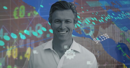 Poster - Image of portrait of smiling caucasian man over moving trading board, graph and numbers