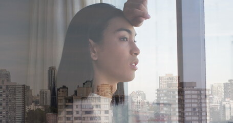 Poster - Image of cityscape over biracial woman looking through window