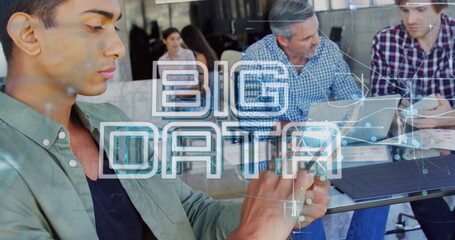 Poster - Image of big data text banner and light trails over biracial man using digital tablet at office