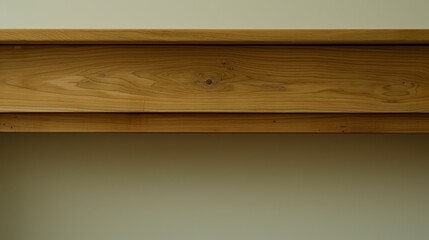 Wall Mural -   A tight shot of a wooden shelf against a middle-distance light green wall