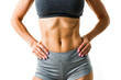© SerPak - Close-up view of a fit woman's torso with well-defined abs, showcasing fitness and health