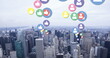 Image of multiple colourful digital social media icons flying over cityscape