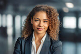 Fototapeta  - smiling african businesswoman in a business suit in an office space