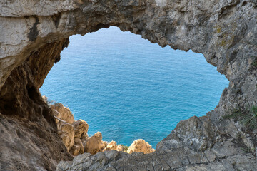 Sticker - Cave entrance in Italy on the Ocean.