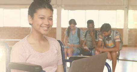 Poster - Image of lights over happy disabled biracial female student using laptop at school