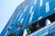 © Jack Tamrong - Group of high rise workers hanging on access rope cleaning highrise glass building in Seoul, South Korea