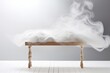 white background with a wooden table and smoke. Space for product presentation, studio shot