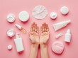 Illustrating a skincare routine for healthy skin, this image showcases a woman's hands holding various skincare products such as facial cotton pads, foam, essential oil, serum