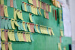 © Aleksandr - On the green board, colored stickers with orders are pasted in an even row with stationery pins. Scrum board in the office for planning and setting tasks for employees