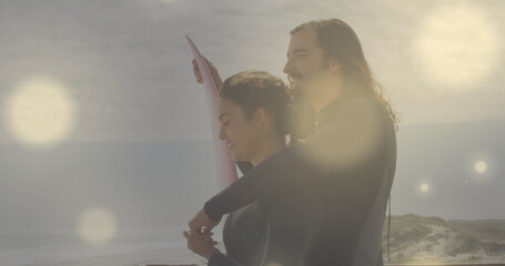 Poster - Image of spots over caucasian couple with surfboard