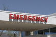 Emergency Room ER and Emergency Department entrance sign for a hospital in alert red.