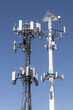 Telecommunications and wireless cell equipment tower with directional mobile phone antenna.
