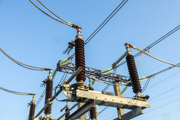 Power transformer and equipment against the background of a high voltage substation.